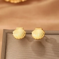 Gold plated stainless steel scallop shell stud earrings in a warm ocean style display - Gold Shell Style (C9961)