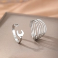 Adjustable stainless steel wrench and multilayered line rings on a neutral display pedestal - Silver Wrench & Multi-layer Style (F818)
