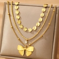 Collier doré à trois rangs avec disques gaufrés, pendentif cristal et grand nœud poli - Style Doré (F953)