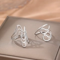 Minimalist silver wavy stackable rings with fluid metal design on a luxury display - Silver Abstract Line Wave Style (C9836)