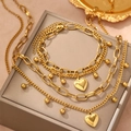 Double-layered gold stainless steel heart necklace and bracelet set on a leather gift box - Golden Heart Style (F101)