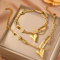 Set collana e bracciale a catena con charms a cuore in oro su sfondo di seta - Oro (F1151)