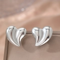 Exaggerated silver 3D heart stud earrings with rippled texture on leather jewelry box - Silver (C5442)