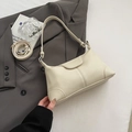 Chic cream white pebble leather Hobo bag with adjustable strap on grey blazer - Off White