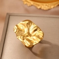 Modern 18K gold-plated stainless steel ring with wavy textured fold design shown in detail - Gold Irregular Wave Style (C6721)