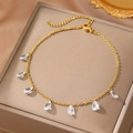 Elegant gold stainless steel anklet with seven clear zircon water drop charms on a brown box - Gold Style (C6141)