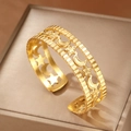 18K gold plated stainless steel open bangle featuring hollow star and moon patterns - Gold Star Moon Style (F2773)