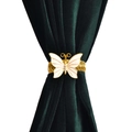 Attache-rideau papillon doré avec ailes nacrées sur fond en velours vert foncé - Style Papillon Doré