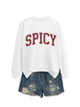 Detail view of casual white sweatshirt with red Spicy print and ripped denim shorts set - White