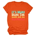 Close-up of retro text print and cotton fabric texture on orange crewneck T-shirt - Orange