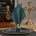 Elegant gold metal spring napkin ring with double pearls on a dark green napkin - Double Pearl Spring Style