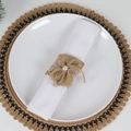 Detail of burlap napkin ring featuring white lace and a central pearl on a white napkin - Natural Burlap Bow