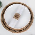 Detail of handmade burlap napkin ring with lace rose on a white plate and woven placemat - Burlap Rose Flower