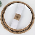 Macro view of jute burlap napkin ring with flower detail on white ceramic plate - Burlap Pearl Flower