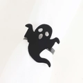 Detail of matte black ghost napkin ring for Halloween table decor on white cloth - Halloween Black Ghost Napkin Ring