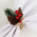 Detail of Christmas napkin ring with pine needles, red berries, and twine bow on fabric - Handmade Christmas Red Berry Napkin Ring