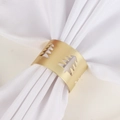 Detail of matte gold hollow Christmas tree napkin ring on white fabric napkin - Hollow Christmas Tree Charm / Matte Gold