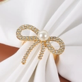 Golden bow napkin ring featuring sparkling rhinestones and a large white center pearl - Pearl Rhinestone Bow Gold Napkin Ring