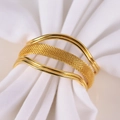 Detailed view of luxury gold woven napkin ring on white fabric for elegant table setting - Gold Metal Woven Open Napkin Ring / Gold