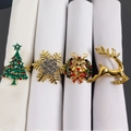 Set of four Christmas napkin rings featuring reindeer, snowflake, and tree designs - Christmas 4-Piece Set (Christmas Tree/Snowflake/Reindeer/Wreath)