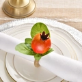 Detailed view of handmade pomegranate napkin ring with red fruit and green leaves - Simulation Pomegranate Style