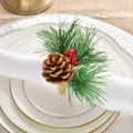 Christmas pine cone napkin ring with red berries and needles on white ceramic plates - Handmade Woven Christmas Pine Cone Napkin Ring