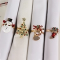 Detail of four Christmas napkin rings featuring snowman and tree designs with crystals - Snowman Christmas Tree Horn And Sock Style (Set 9)