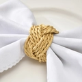 Handcrafted natural woven straw napkin ring knot on a white cotton linen napkin - Handmade Straw Woven Style