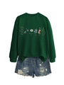 Detail of dark green floral sweatshirt featuring colorful prints and ribbed cuffs - Dark Green