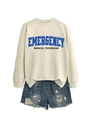 Detail of emergency medical technician print on cream sweatshirt with ripped denim shorts - Sand Sweatshirt (Black Text)