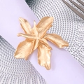 Golden flower napkin ring with brushed metal texture on a white cloth in a dining setting - Gold Oversized Elegant Flower Napkin Ring