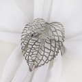 Elegant silver hollow leaf napkin ring with detailed metallic texture on white fabric - Silver