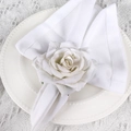 Detail of elegant white fabric rose napkin ring on a scalloped ceramic plate - White (White Fabric Rose Napkin Ring)