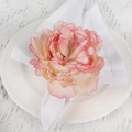Detailed view of pink fabric rose napkin ring on a white plate for wedding decor - Pale Pink (Pale Pink Fabric Rose Napkin Ring)