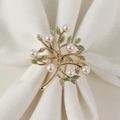 Golden money tree napkin ring with green enamel leaves and pearls on white cloth - Gold Style