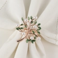 Rose gold tree napkin ring with white pearls and green leaves on white linen - Rose Gold Style
