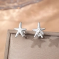 Polished silver starfish stud earrings with ocean theme on elegant satin background - Mirror Silver Starfish Style (C5582)