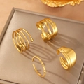 Macro shot of 4-piece irregular gold wave stainless steel rings on a jewelry box - Gold 4-Piece Set (C9869)