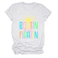 Detail of Boatin and Floatin text with sun graphic on a white cotton T-shirt - White