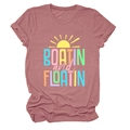 Flat lay of pink short sleeve t-shirt with Boatin and Floatin text and sun graphic - Rose Gold