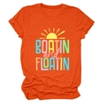 Detail of soft orange cotton T-shirt featuring vibrant sun and outdoor themed print - Orange
