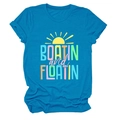 Close-up of Boatin and Floatin letter print on soft bright blue cotton T-shirt fabric - Lake Blue