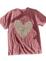 Detail of leopard print heart design on a dusty pink short sleeve t-shirt fabric - Peach