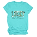 Detail of turquoise cotton T-shirt featuring a festive Lucky Teacher clover print - Deep Water Blue