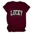 Close-up of the wine red fabric texture and St. Patrick's Day Lucky Teacher print on the tee - Burgundy