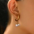 Vintage gold hoop earrings with white pearls shown on model in a warm elegant style - Round Hoop Pearl Style (C1659)