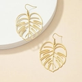 Macro detail of gold hollow leaf earrings with intricate monstera plant line textures - Gold Style (C6159)