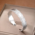 Adjustable wide feather open bangle in silver finish with detailed wing texture - Silver Feather Style (F2998)