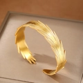 Polished 18K gold-plated wide feather cuff bangle made of stainless steel with texture - Gold Feather Style (F2997)