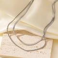 Close-up of double-layer silver herringbone and twisted rope chain on stone - Silver Style (C2440)